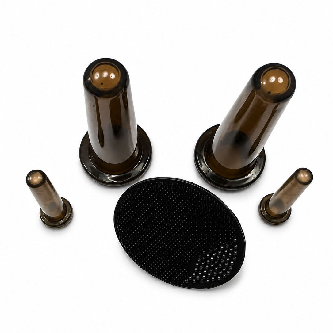 Set of brown cylindrical objects and a black textured disc on a white background